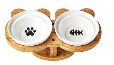 Ceramic cat bowl set with two white bowls featuring a paw print and fish bone icon.