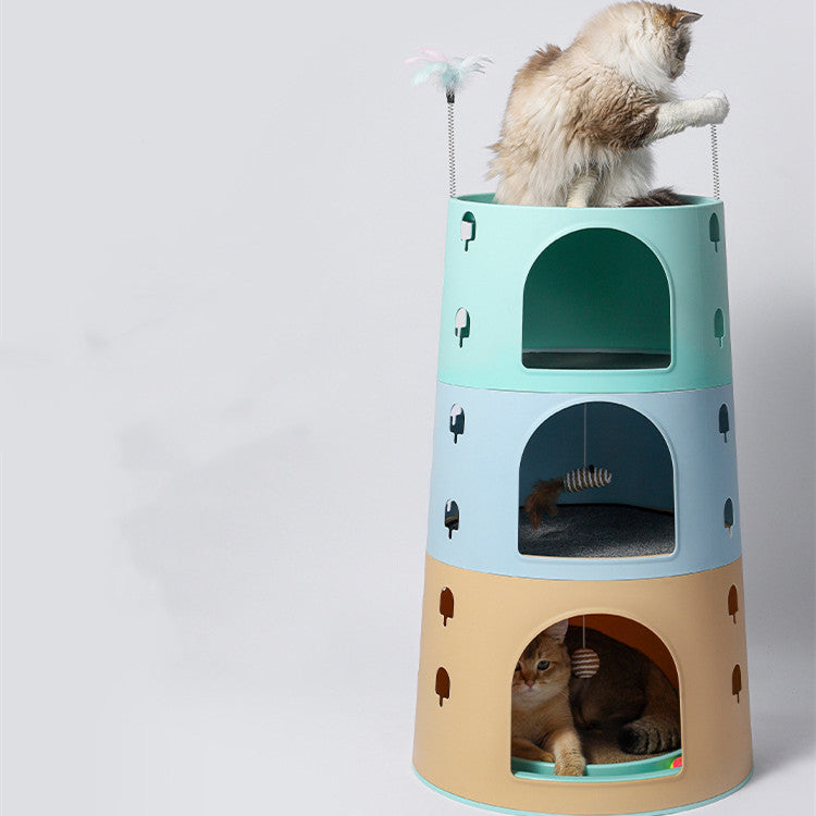 Cat multichamber cat tower with three stacked pods, mint top, dark green arch; cat perched