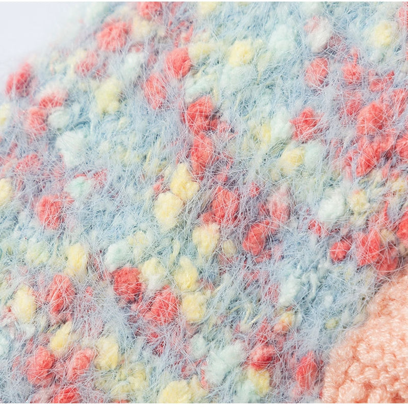 Close-up of multicolor fuzzy knit fabric with textured yarn pattern