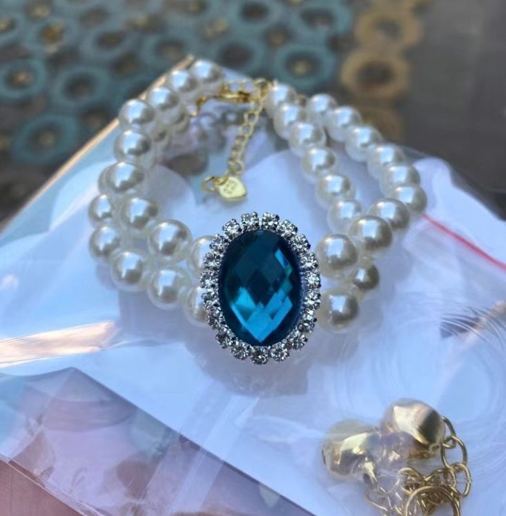 Pearl cat pet collar with blue oval gem and rhinestone halo