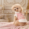 Pink tweed dog coat vest with faux fur collar, decorative gold trim, and pearl accents.