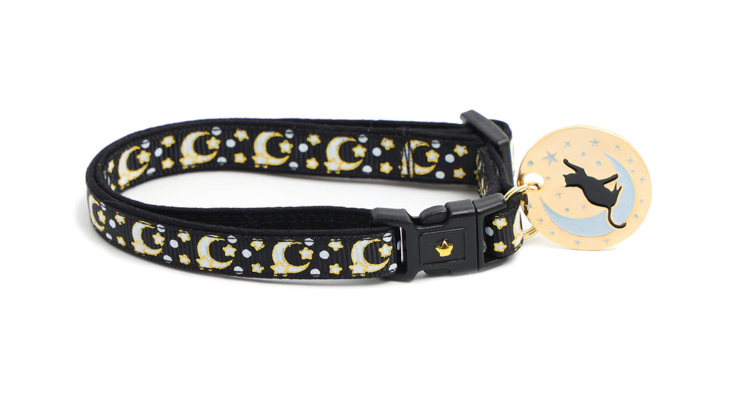 Gold moons and stars on black cat collar with oval charm and cat silhouette