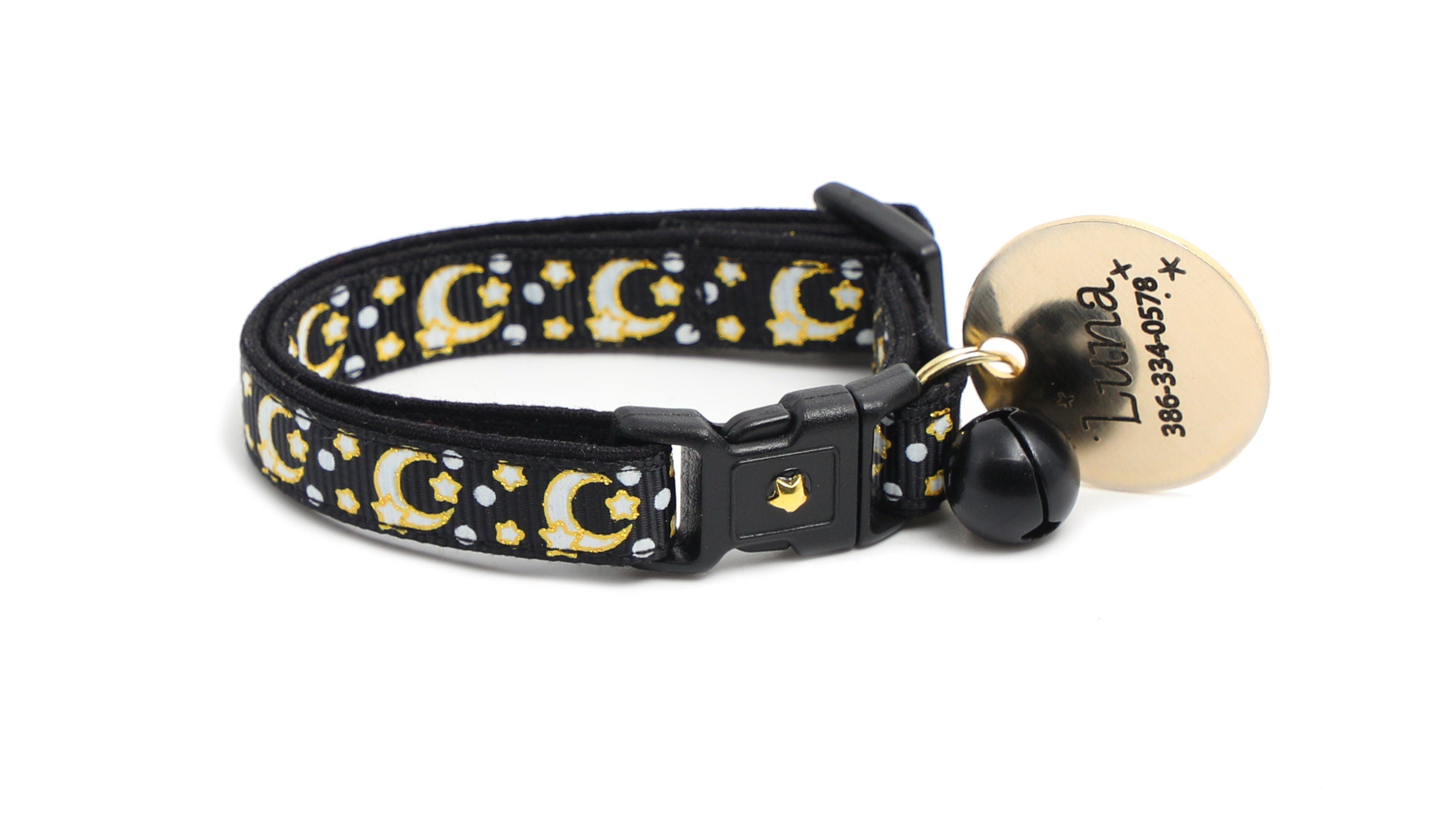 Black cat collar with gold moons and stars, personalized oval Luz ID tag, and black bell