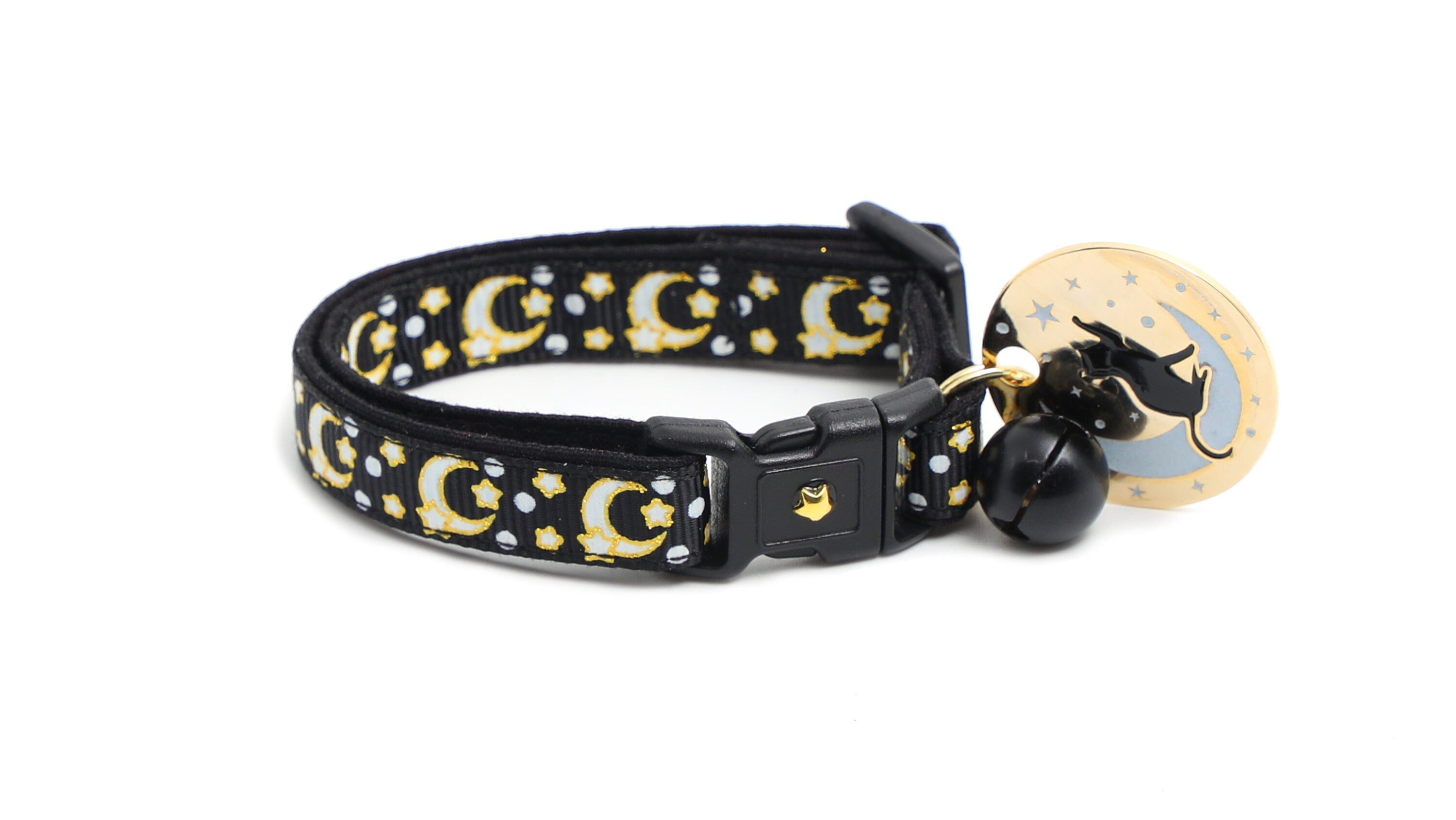 Gold moons and stars on black cat collar with oval charm and black bell
