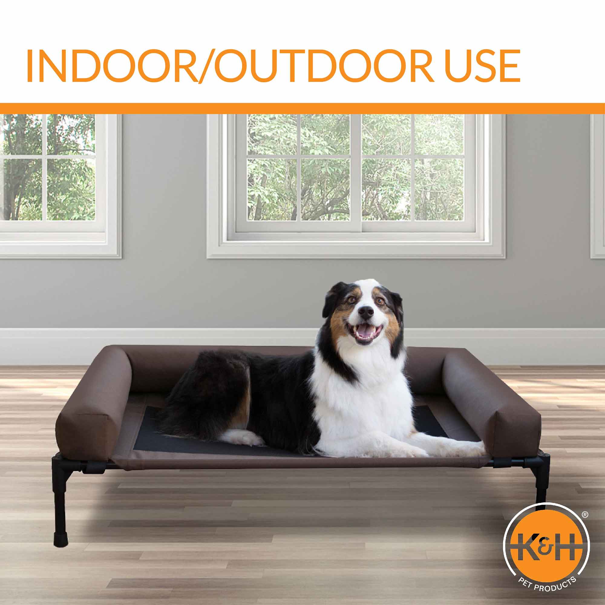 K&H elevated pet cot with bolsters and dark mesh center in chocolate and black indoors