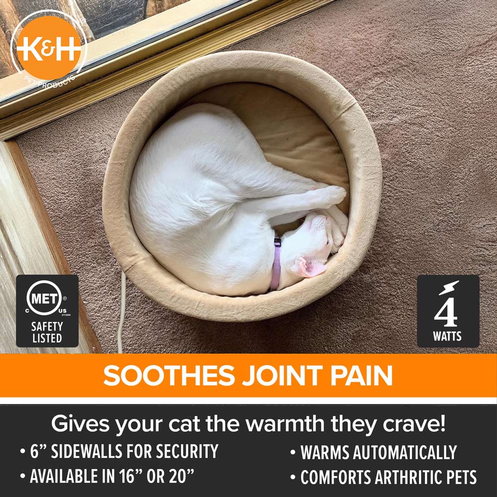 Heated cat bed with beige inner cushion and round bolster edge, with white cat sleeping
