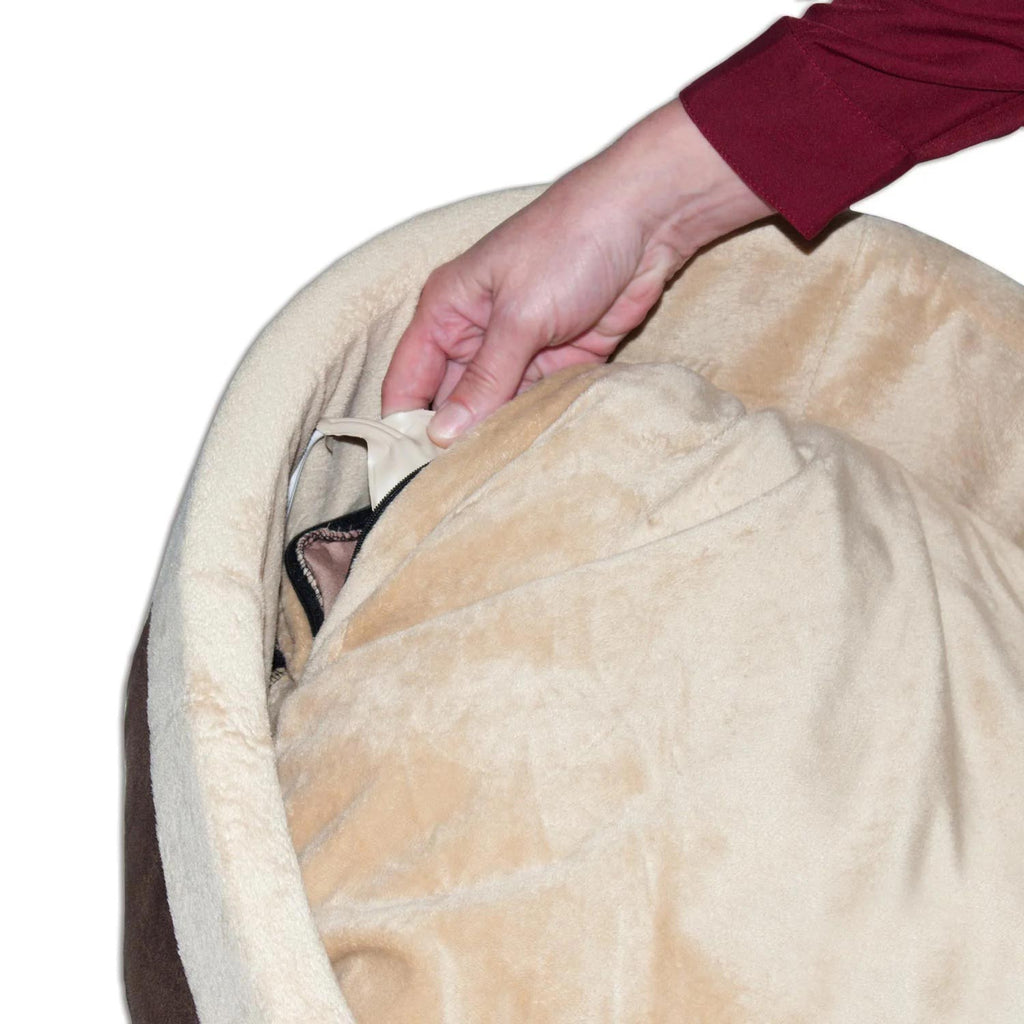 Heated cat bed cushion with outer cover lifted open, showing the inner warmer insert