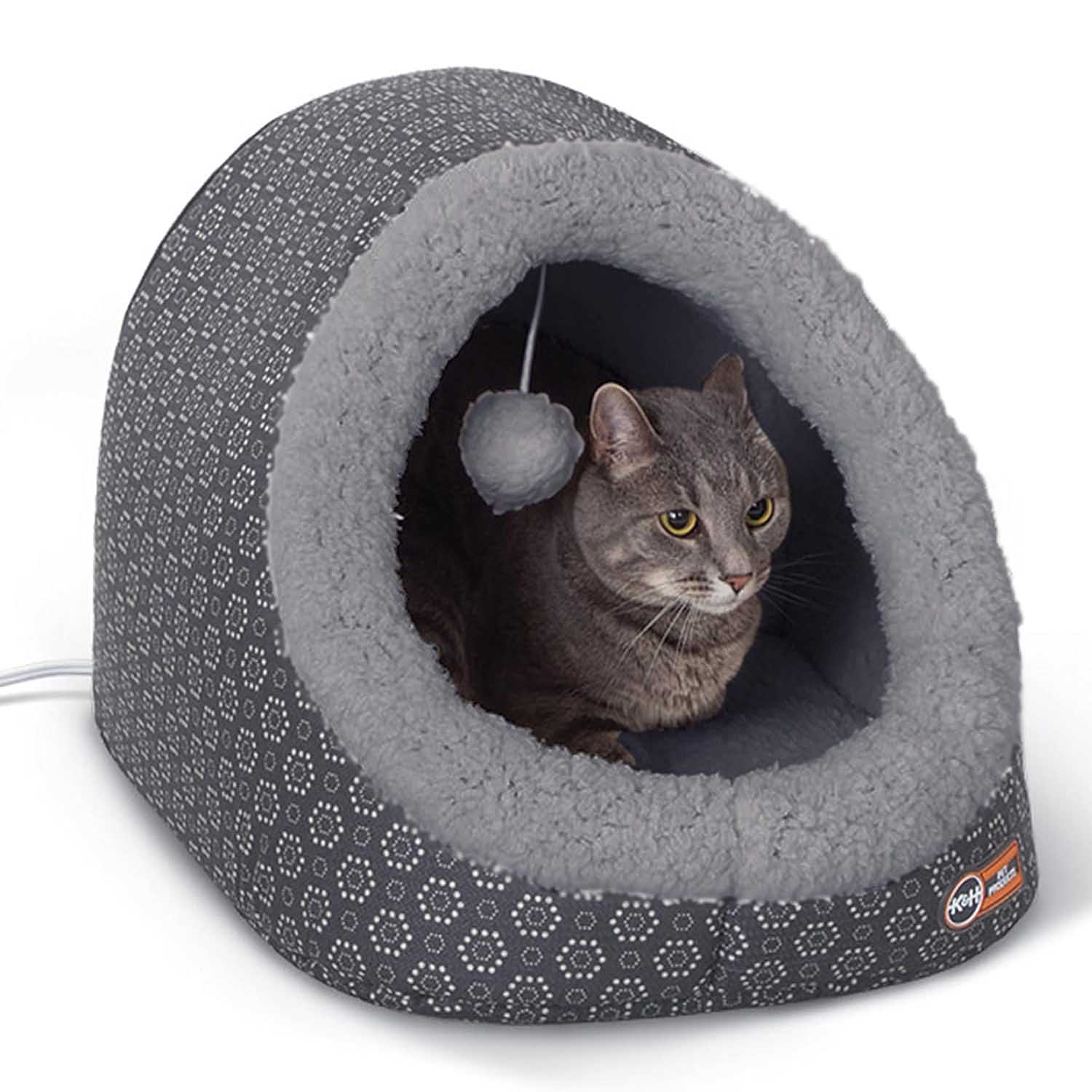Heated plush cat cave bed with grey tunnel lining and dark blue patterned shell, cat inside