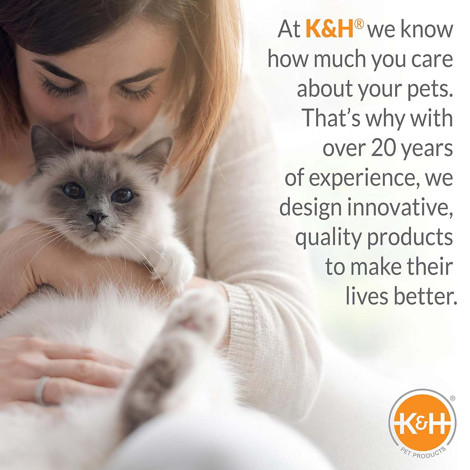 Heated cat bed with cat being held by person, cozy indoor pet setup