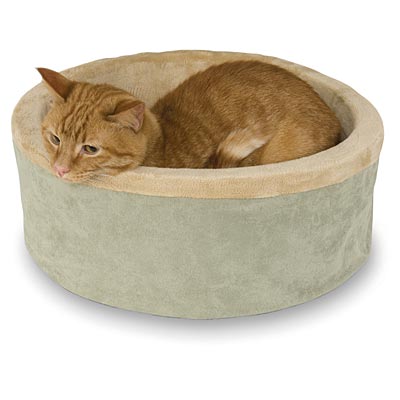 Heated cat bed in sage green with plush round design