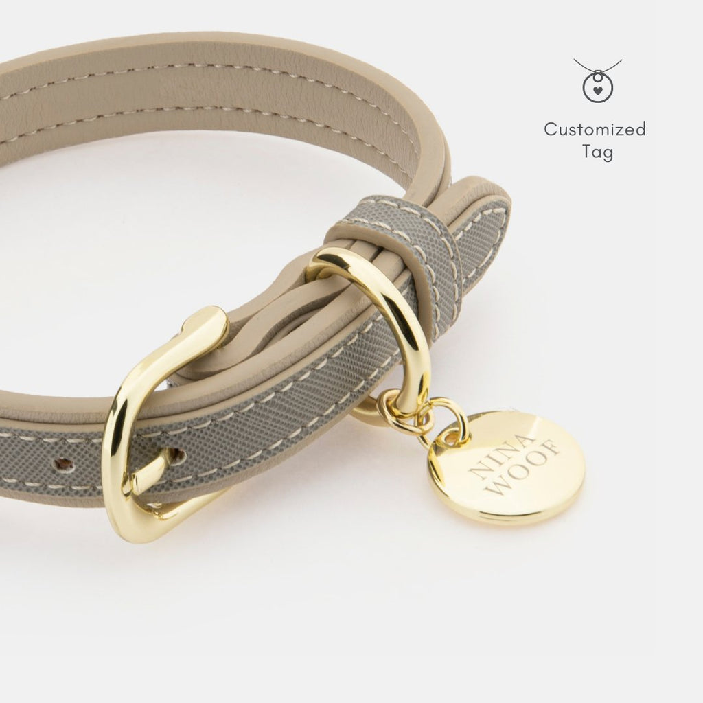 Grey vegan leather dog collar close-up with gold clasp and customized round tag