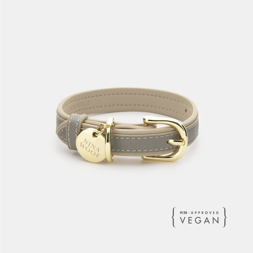 Grey vegan leather dog collar with gold buckle and round brand tag