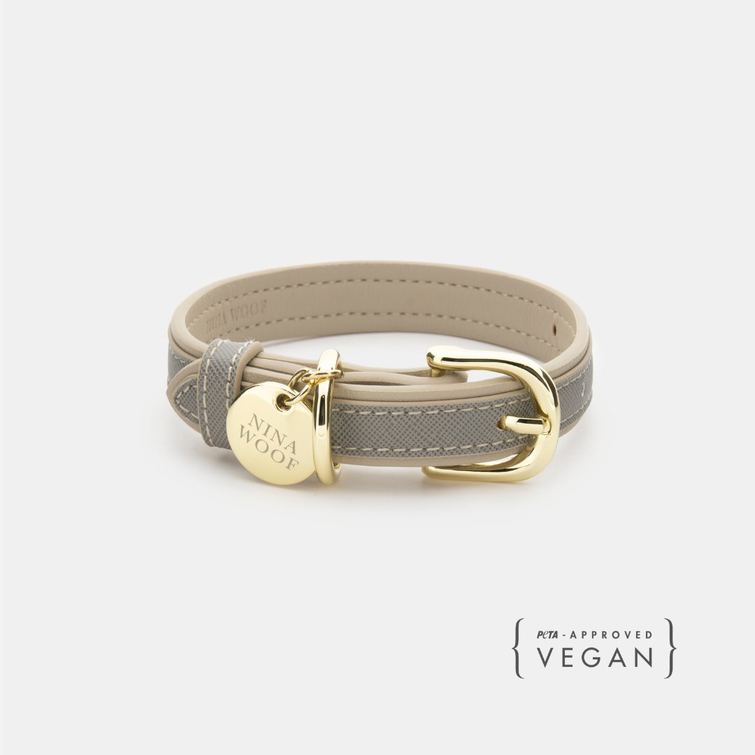 Grey vegan leather dog collar with gold buckle and round brand tag