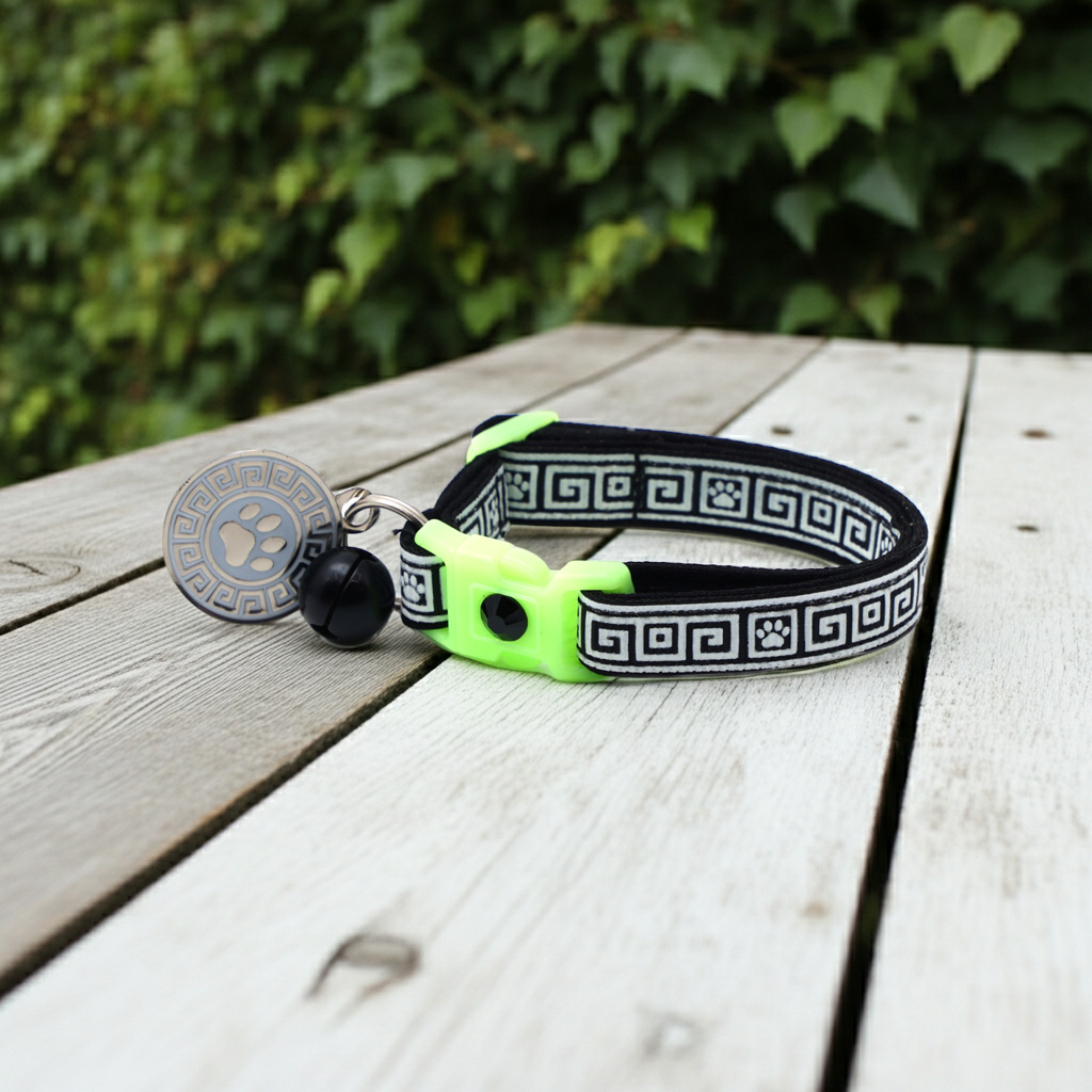 Neon green and black Greek key cat breakaway collar with paw pattern, bell and round charm