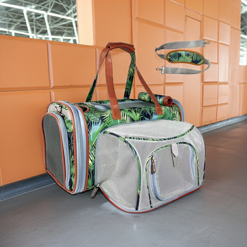 Expandable pet carrier with tropical leaf print, mesh panels, and gray fabric for travel