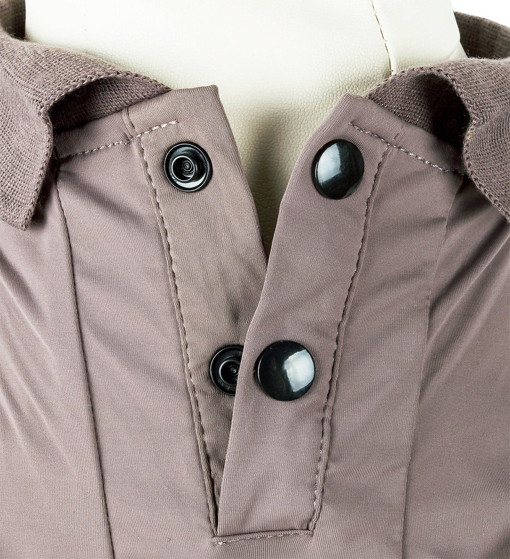 Brown dog polo close-up: snap-button placket and collar seam