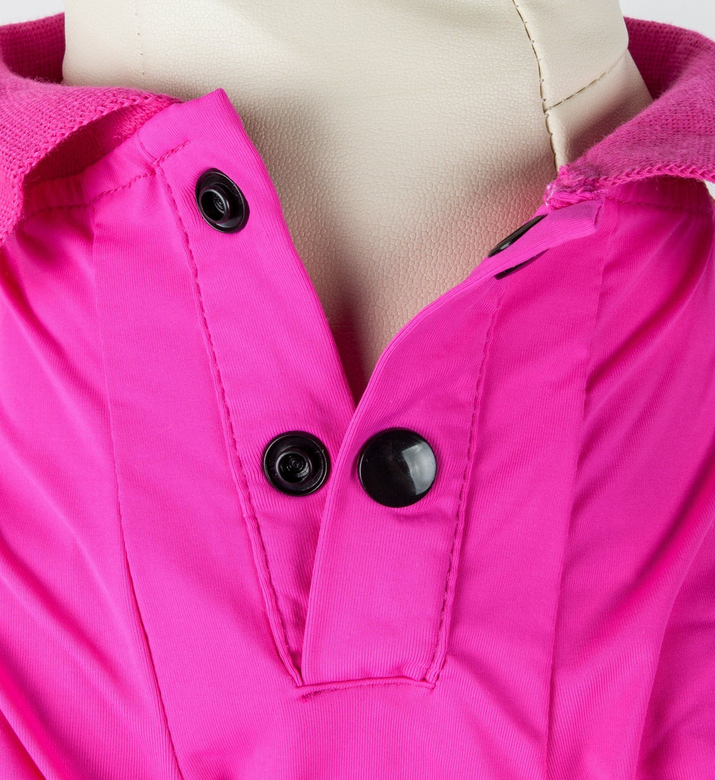 Bright pink dog polo close-up: snap buttons on front placket