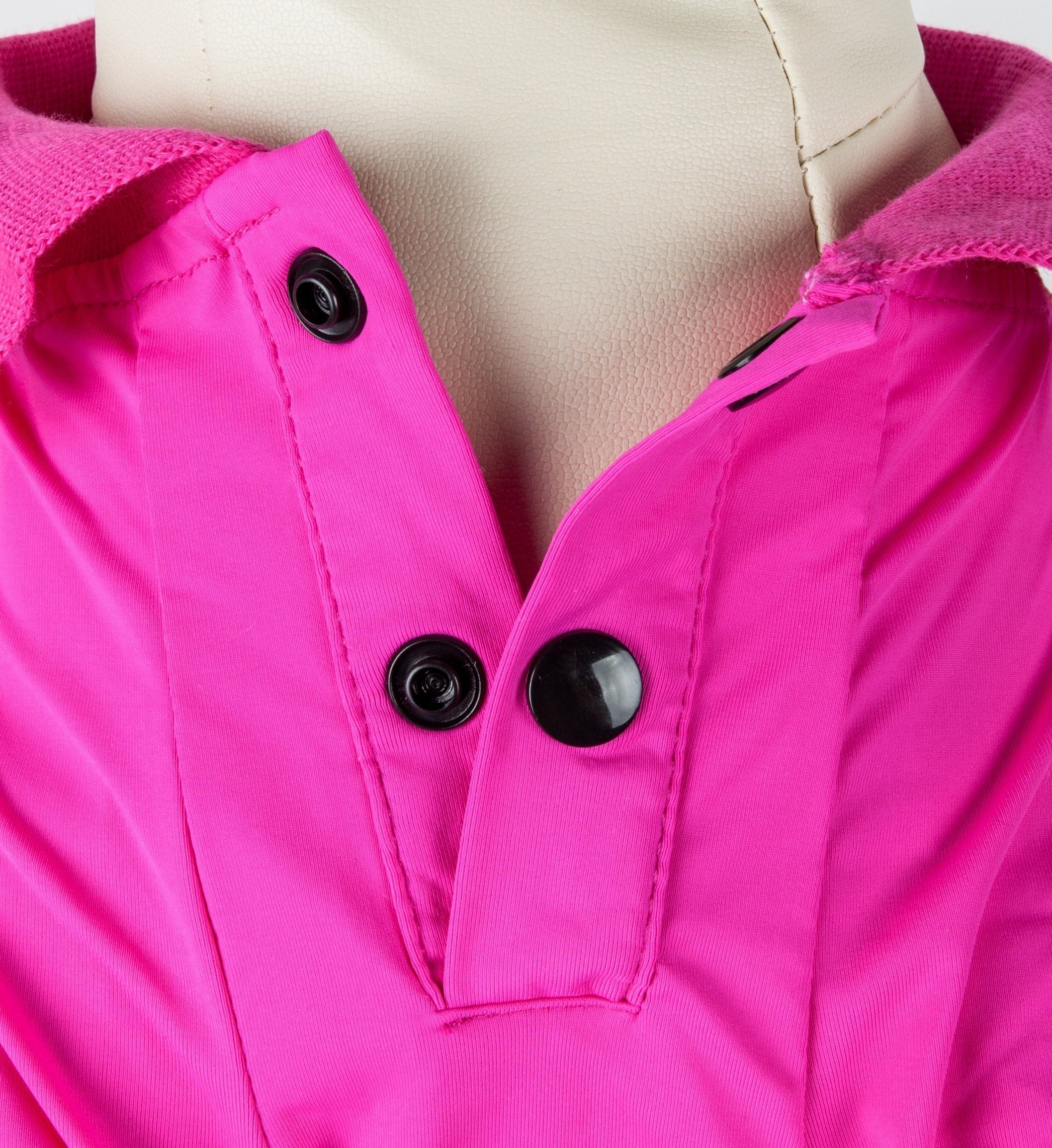Bright pink dog polo close-up: snap buttons on front placket