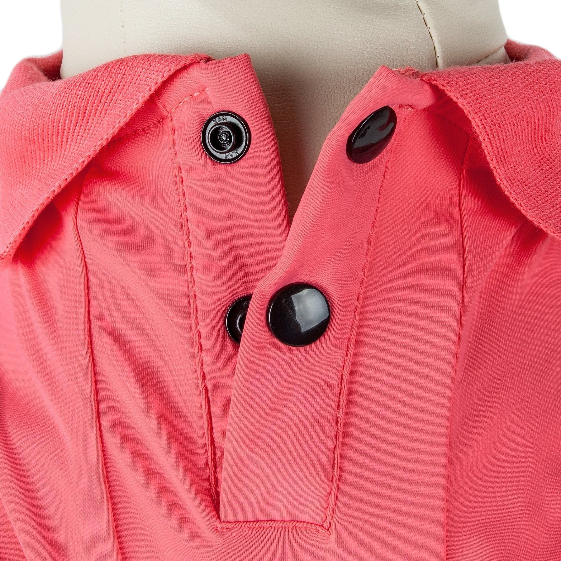 Pink dog polo close-up: snap buttons on front placket