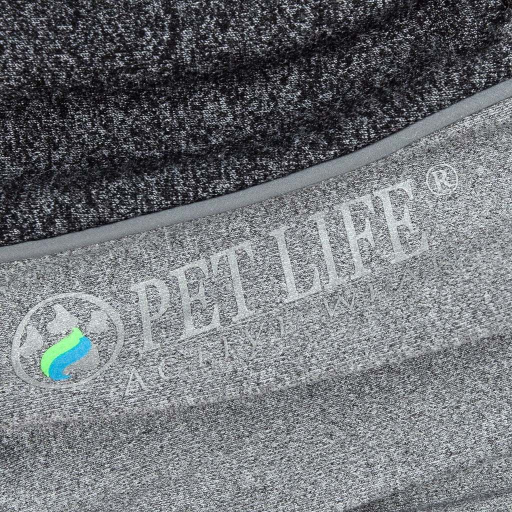 Close-up of charcoal gray fabric with printed logo on dog tracksuit side panel