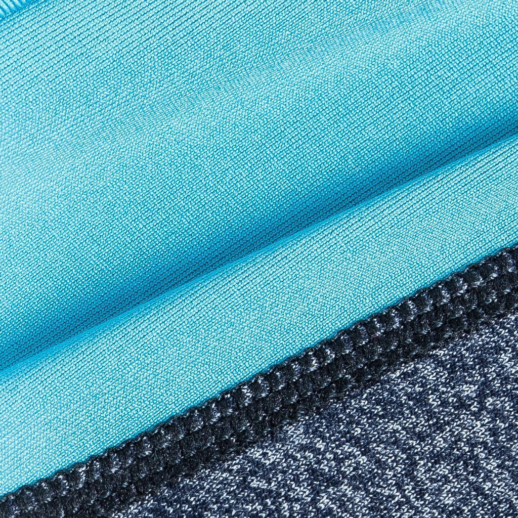 Close-up of blue heather stretch fabric with dark knit edge trim