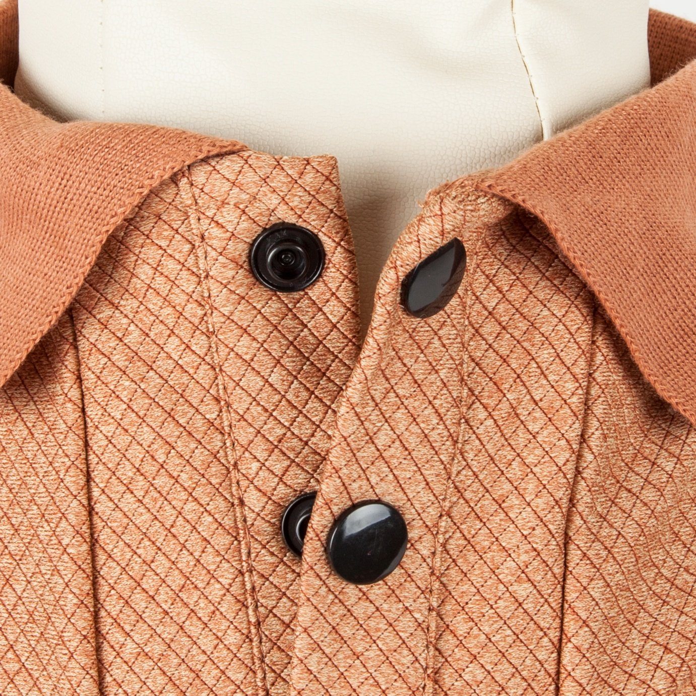 Tan dog polo shirt with diamond-textured fabric and black buttons, ribbed collar