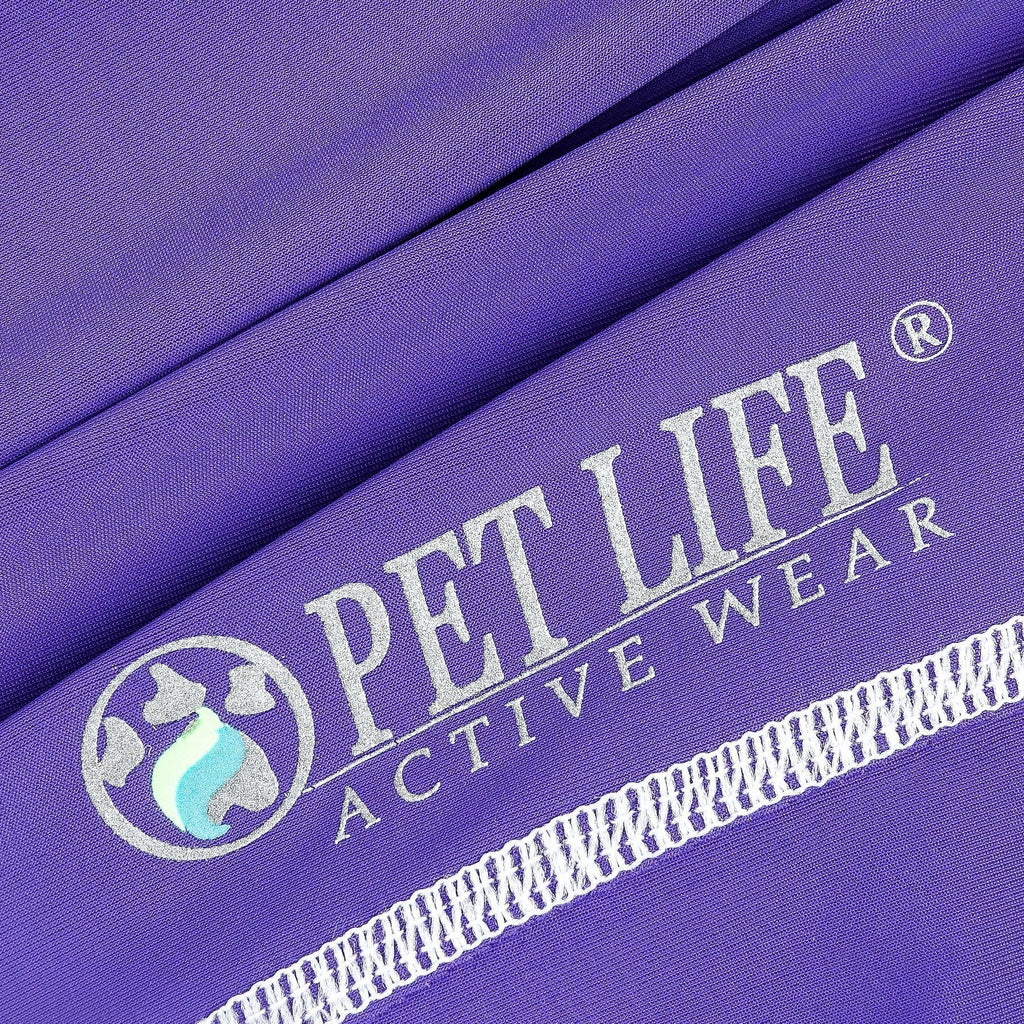 Purple fabric close-up with printed logo and white trim stitching