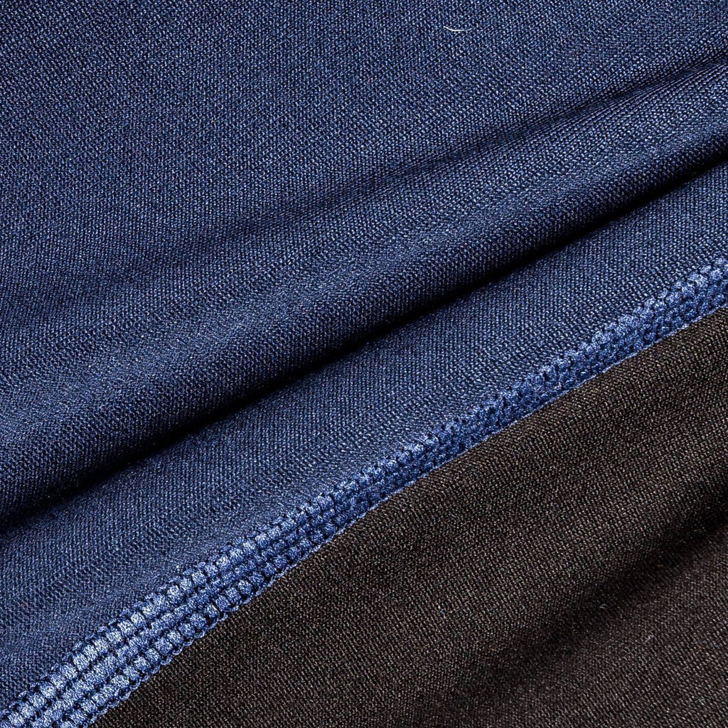 Dark blue dog yoga warm-up tracksuit fabric close-up with stitched seam