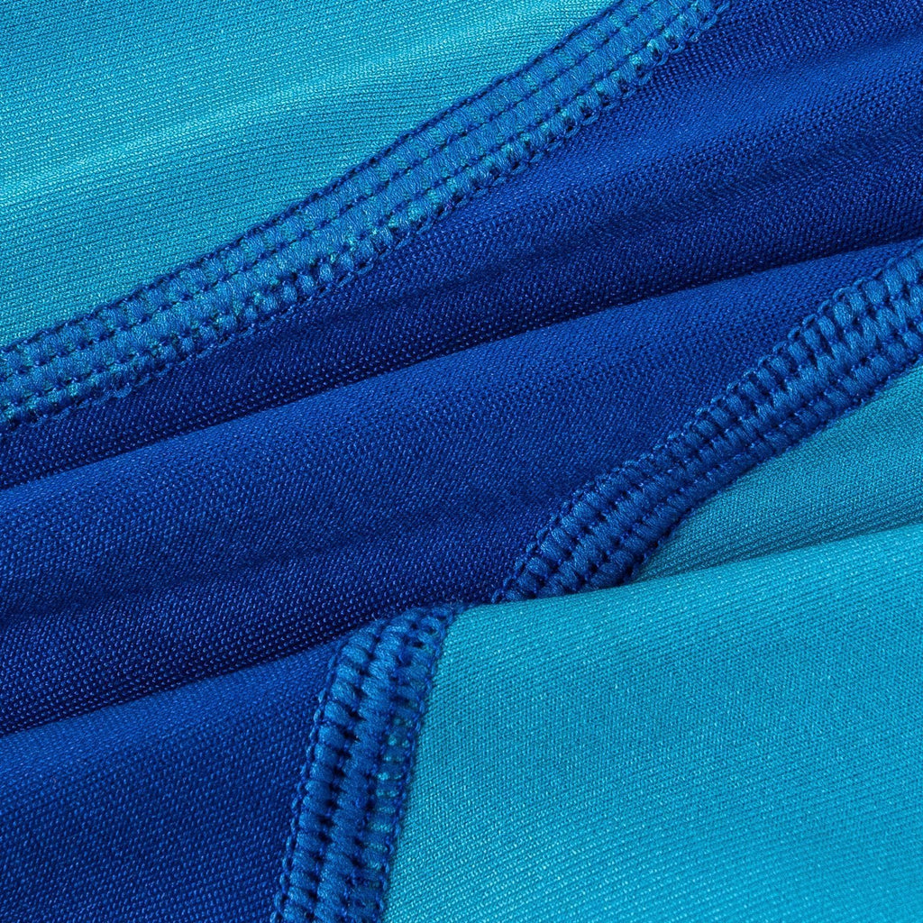 Blue dog warm-up tracksuit fabric close-up with contrast stitching