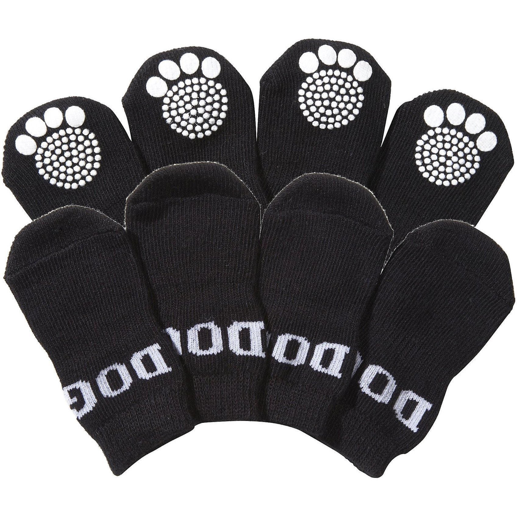 Set of 4 black dog socks with white paw-print grip soles, anti-slip tread