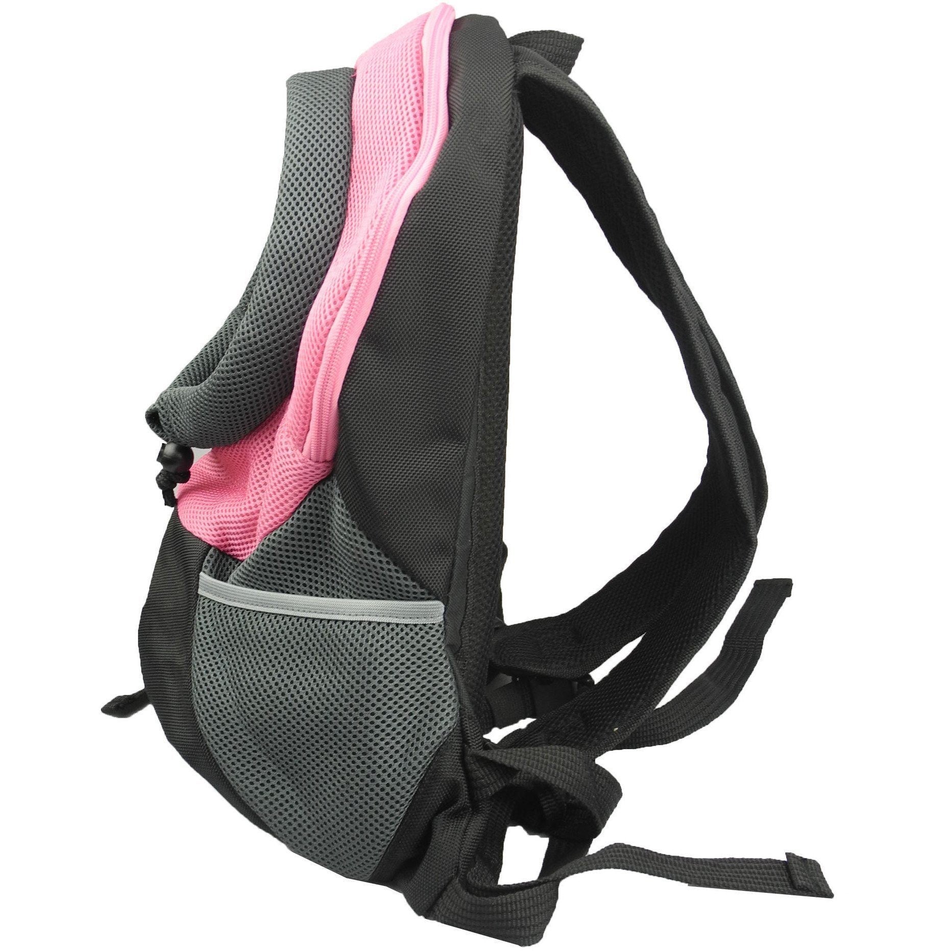 Pink and black dog backpack carrier with gray mesh panel; side view of front pocket.