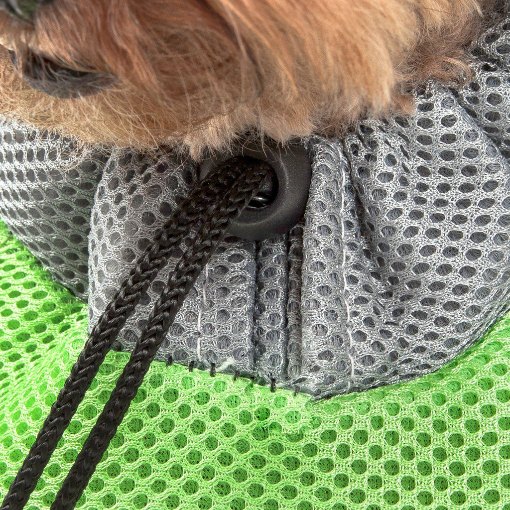 Green mesh and gray fabric pocket of a dog backpack carrier with black drawstring.