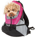 Pink mesh dog backpack carrier with black straps; small curly-haired dog peeks from front.