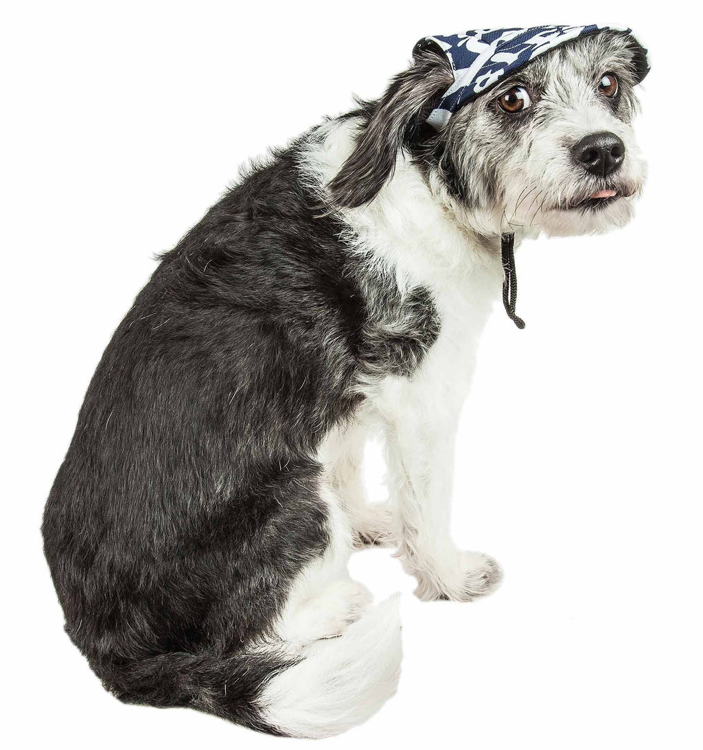 Dog wearing navy-and-white camo graffiti UV hat with hanging chin cord