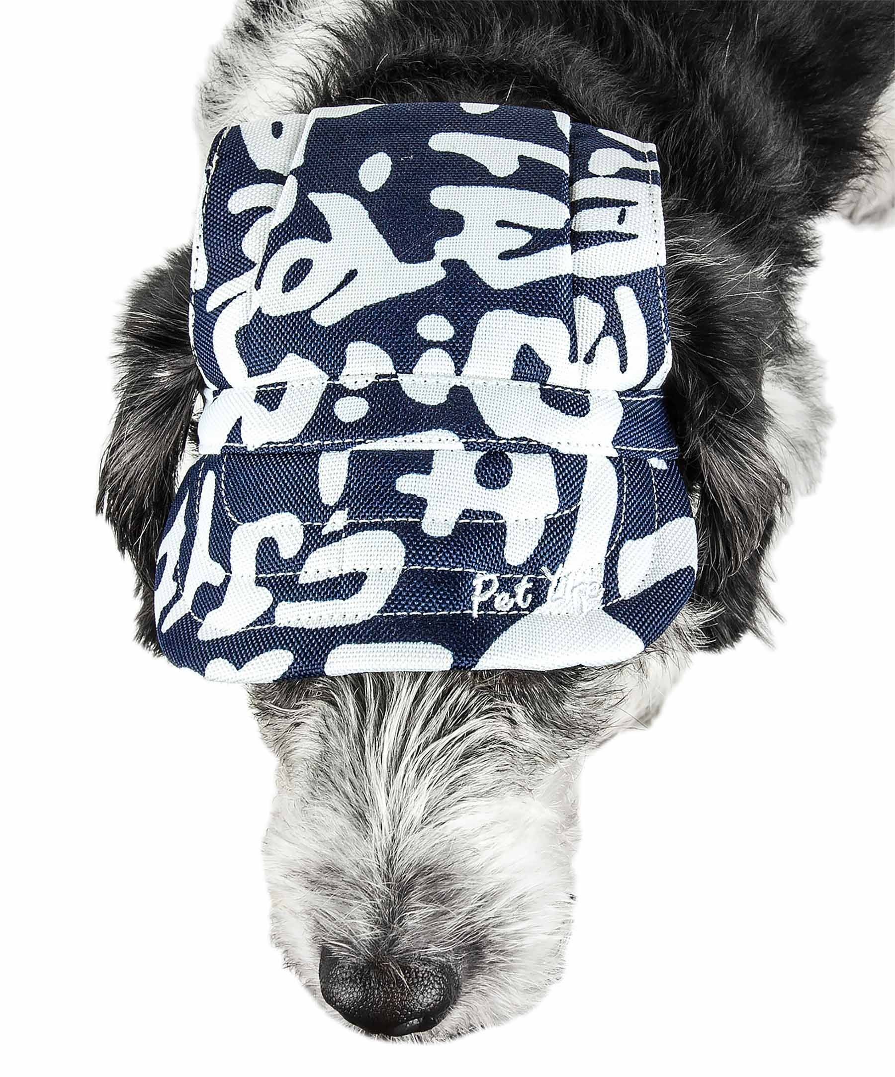 Dog hat in navy/white graffiti camo with ruched back and logo patch