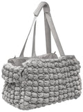 Gray plush pet carrier tote with long shoulder straps and bubble-texture exterior
