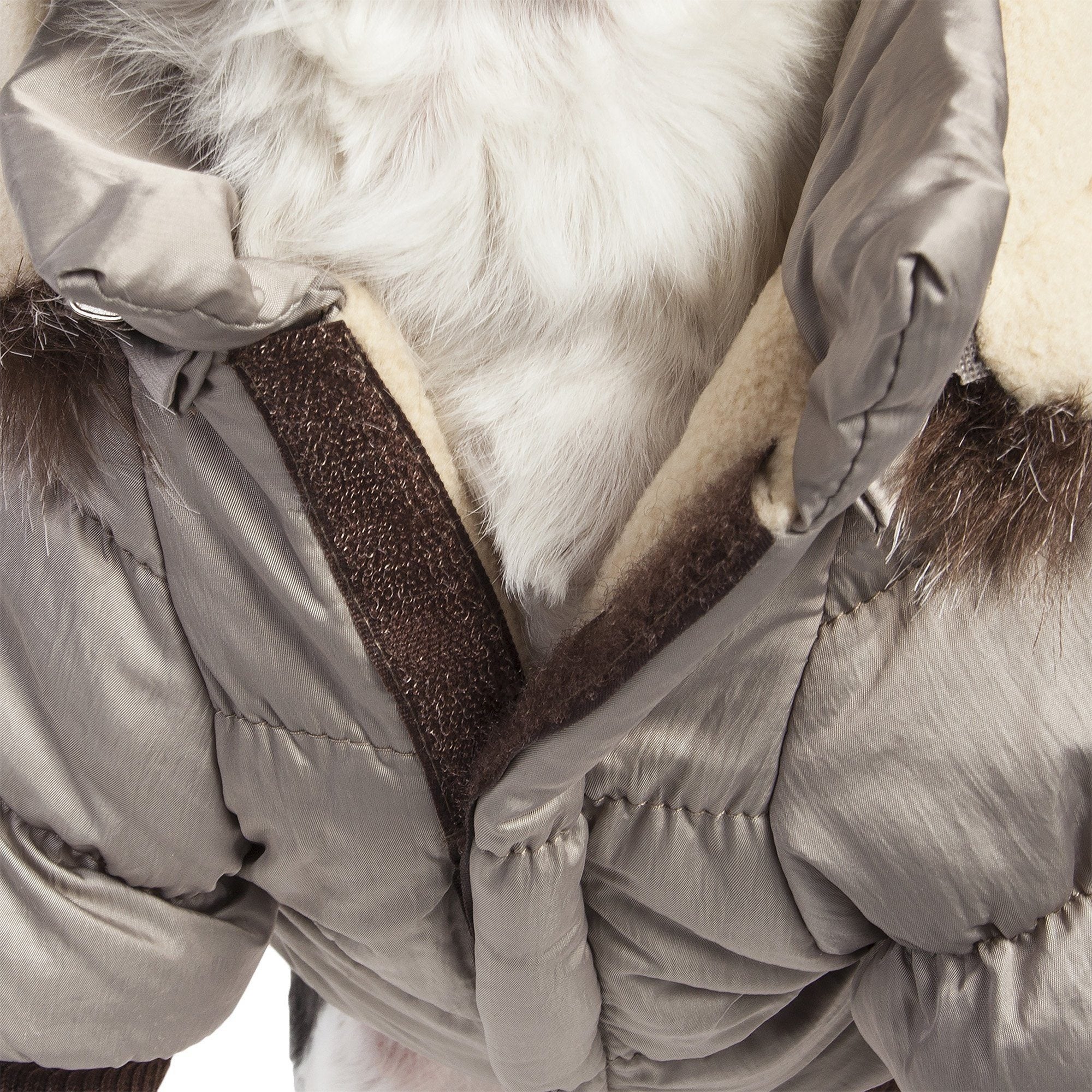 Metallic gray dog parka with removable hood and dark faux-fur trim, close-up at chest