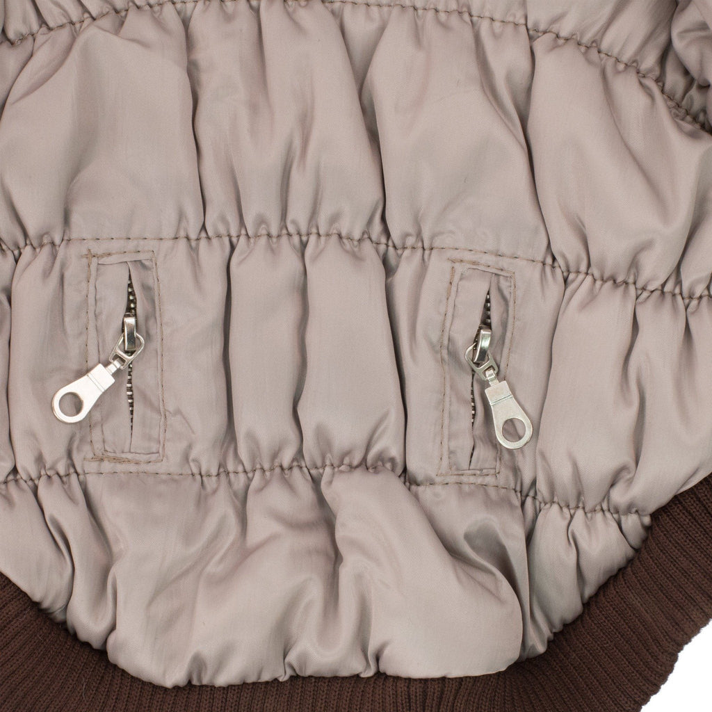 Metallic gray dog parka side panel with ribbed cuff and two metal zipper pull accents
