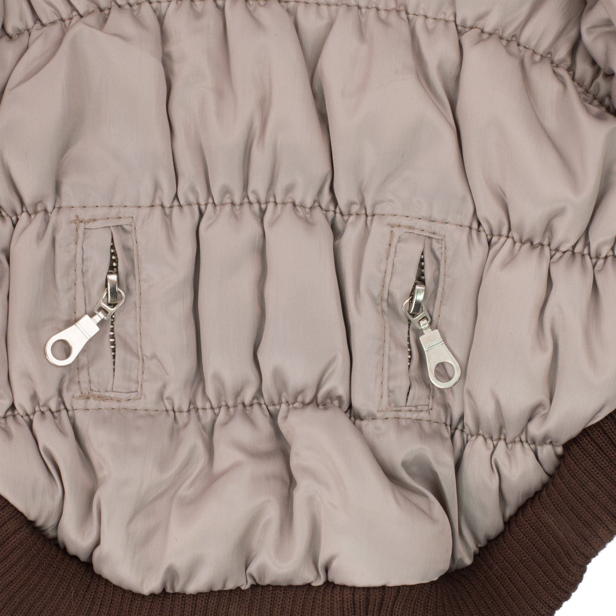 Metallic gray dog parka side panel with ribbed cuff and two metal zipper pull accents
