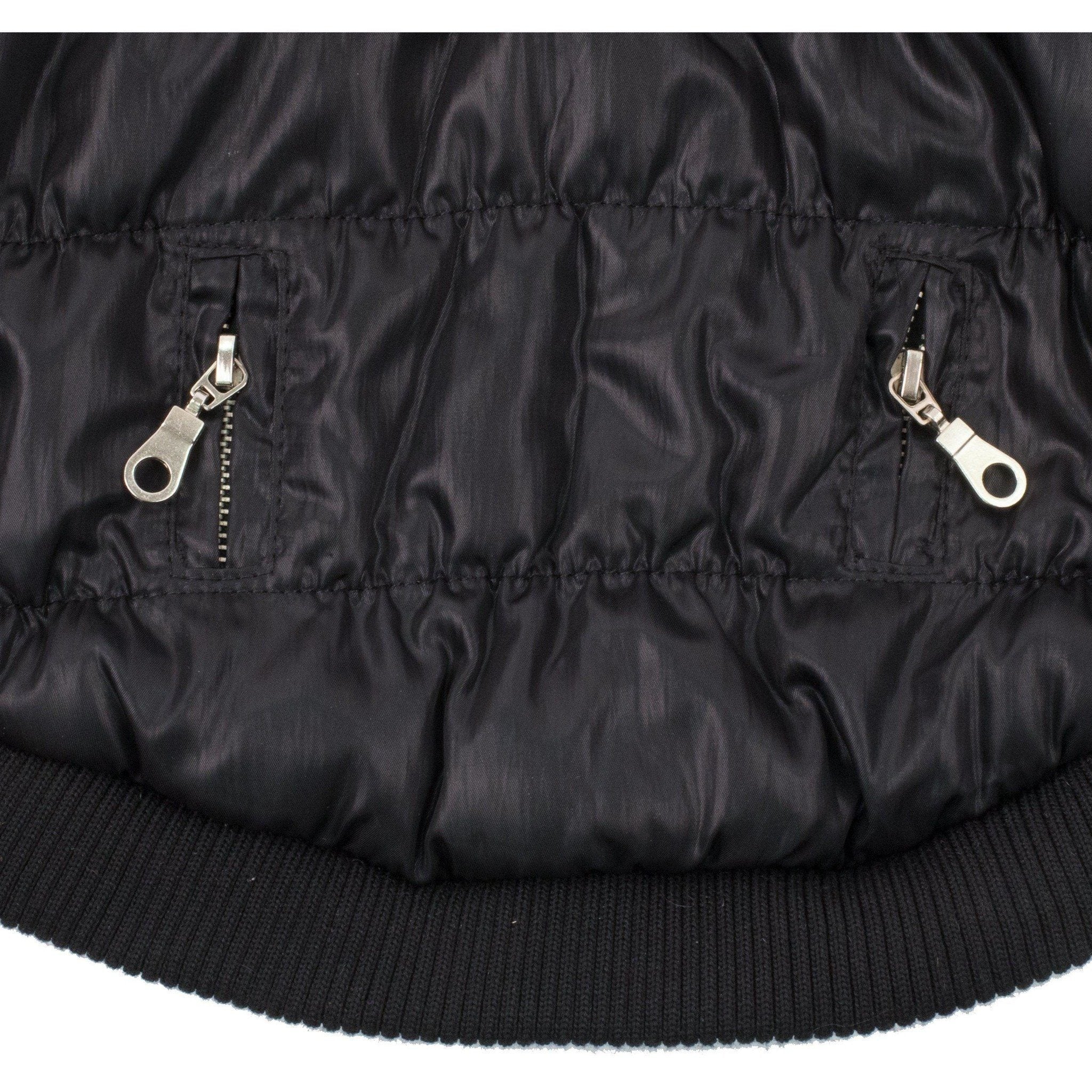 Dark insulated dog coat hem with ribbed cuff and two metal zipper/loop accents
