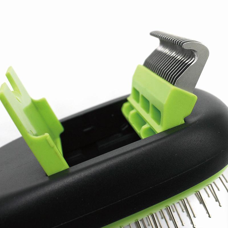 Close-up of green grooming brush head with removable metal pin comb attachment