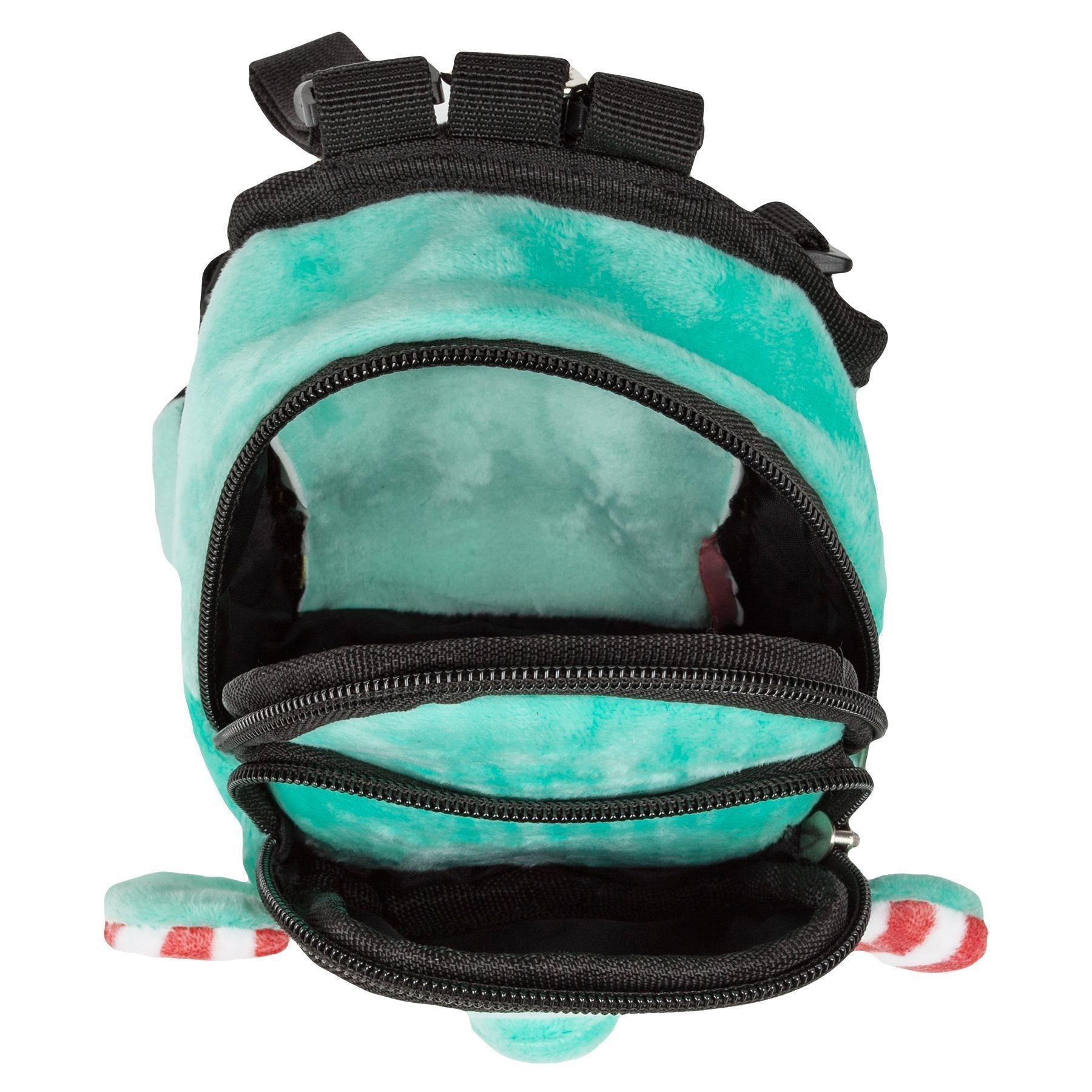 Open front pocket on mint plush harness backpack with black interior lining