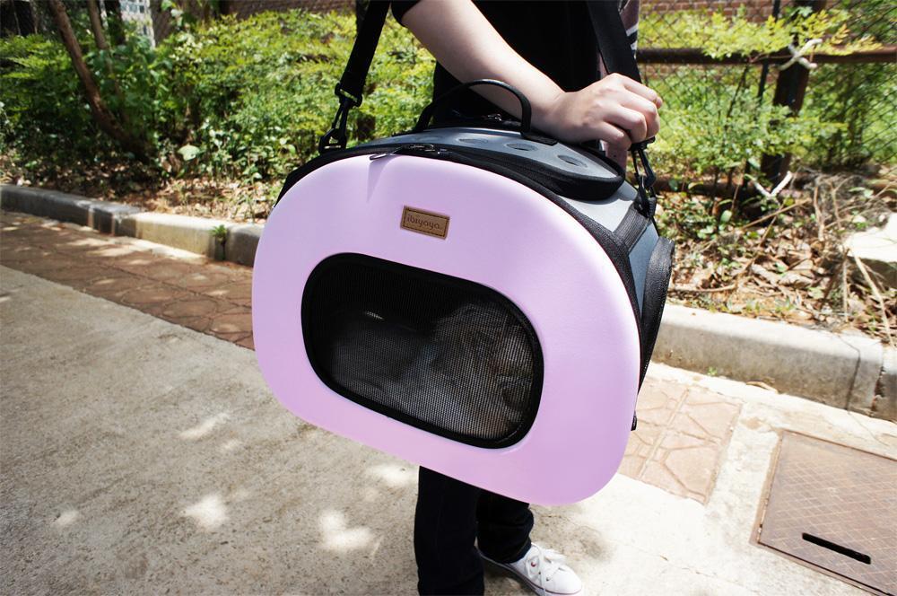 Lilac/purple wheeled pet carrier crate with front oval mesh window and handle