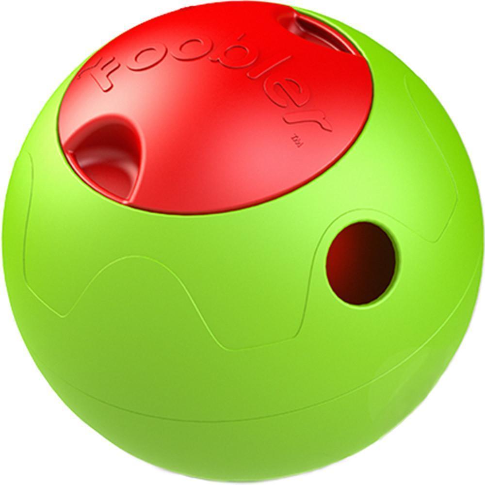 Close-up of green puzzle food dispenser ball with red lid and opening