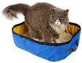 Gray-and-white cat using blue folding waterproof litterbox with black trim and litter
