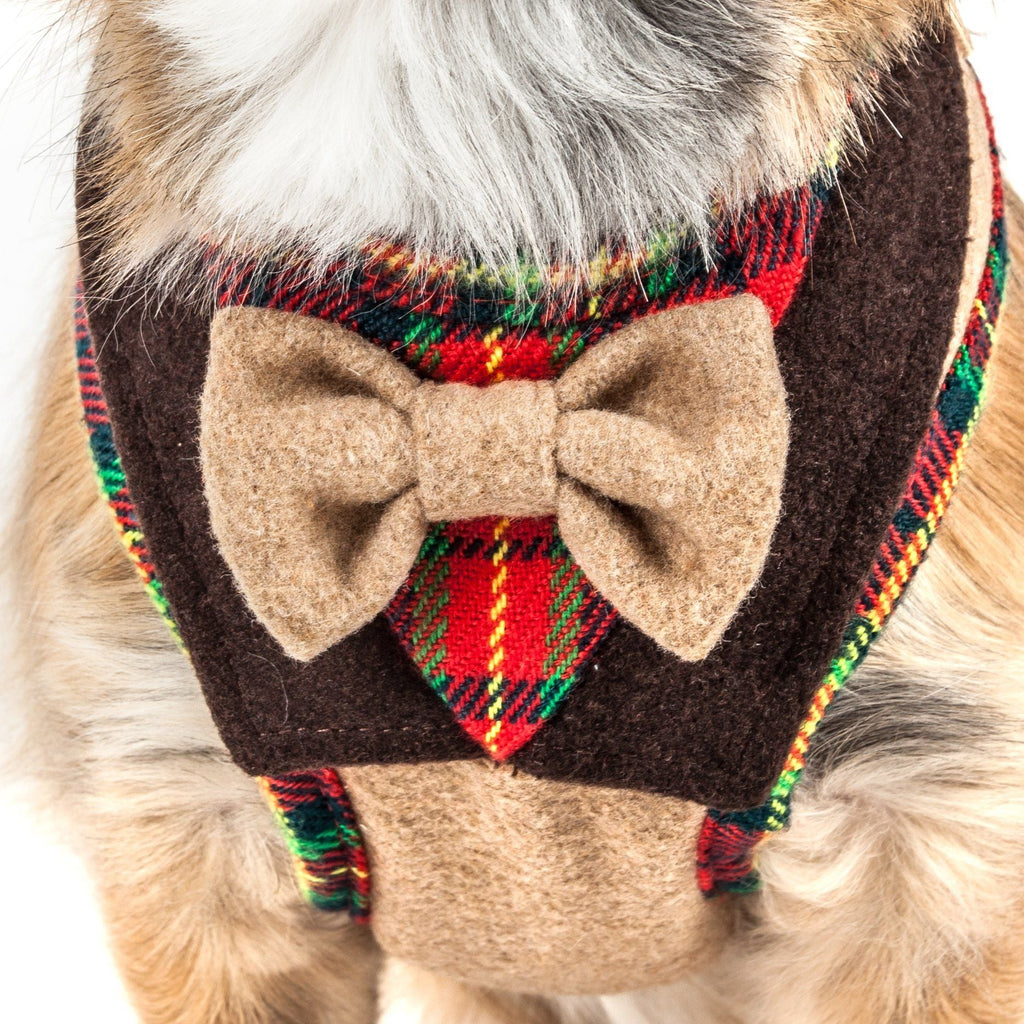 Close-up of felt dog harness with beige bow and colorful plaid trim
