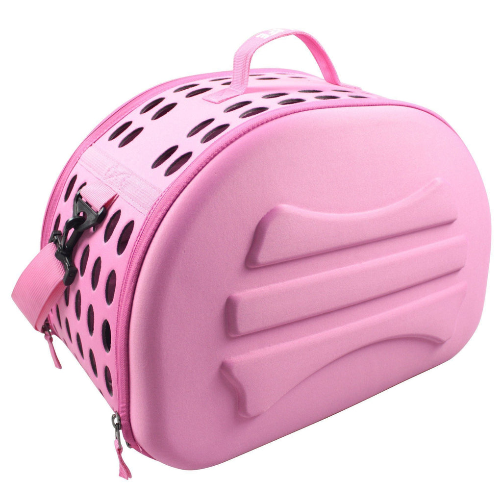 Pink pet carrier crate with black vent holes on top and zippered side closure