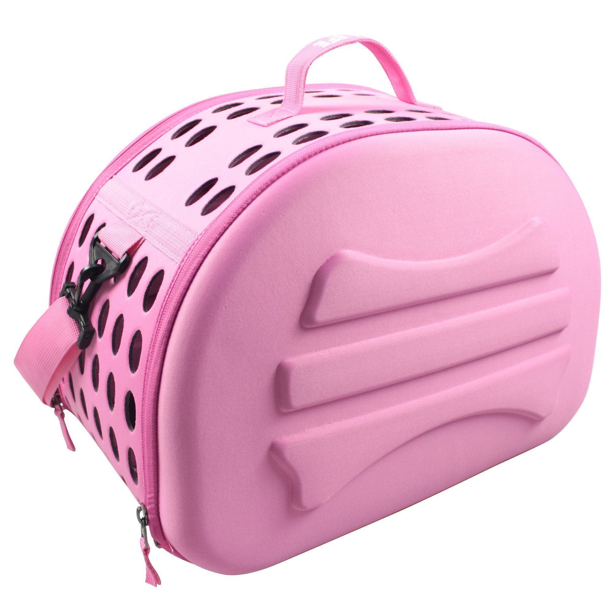 Pink pet carrier crate with black vent holes on top and zippered side closure