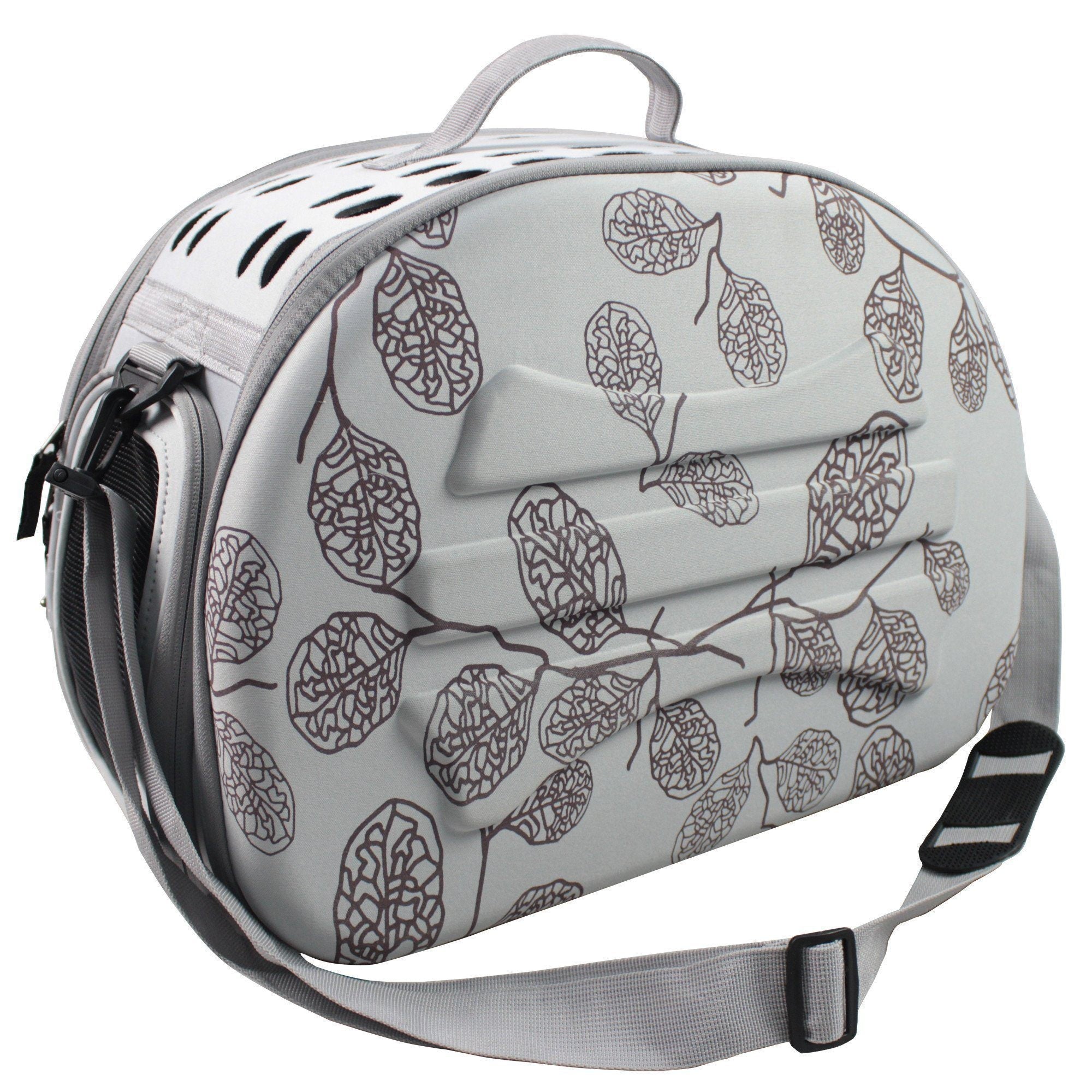 Light grey pet carrier crate with dark leaf pattern shell and black shoulder straps