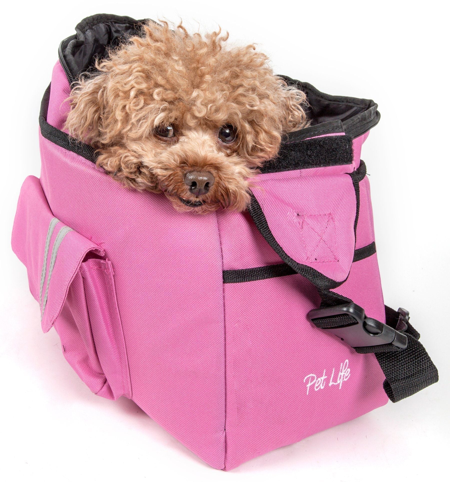 Pink over-the-shoulder dog carrier with padded support and front pouch; dog inside